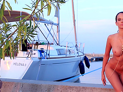 Beauty on the dock stripping lustily from her sexy bikini