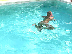 Lingerie clad solo model with big tits enjoys an enticing nude photo shoot in the pool