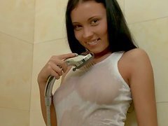 Teen beauty takes a shower and plays with herself