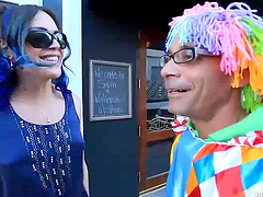 Beautiful tranny and a clown have anal sex in bed