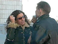 Curly haired bitch is in heaven after being jizzed on by two dudes