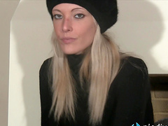 Close up of Christelle taking off her high heels and showing her bare feet