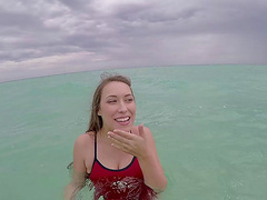 Babe goes from the ocean to sucking his dick in the bathroom