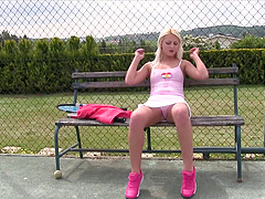 Solo model Katy E flashes and fingers her pussy on a tennis court