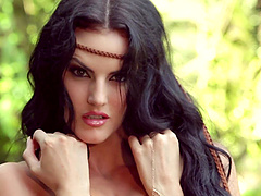 Brunette model communes with nature by getting naked