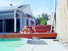 Girls in bikinis making hot love to each other poolside