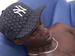 Tall black guy gets his dick stroked by a white boy