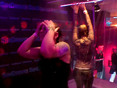 Erotic lesbian babes showcases their dirty dance moves at a raining podium