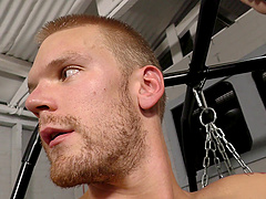 Burly black guy butt fucks a white bottom in the gym