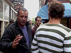 Hooker teasing in a street window fucks a guy on film