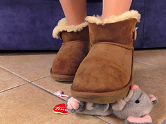 Babe in soft boots stomps on a stuffed animal for you