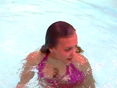 Bikini babe with wonderful titties swims in the pool