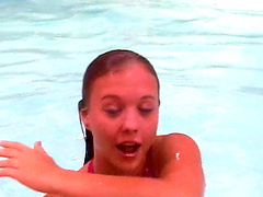 Bikini babe with wonderful titties swims in the pool