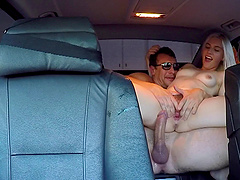 Hot blonde in a miniskirt rides a big cock in his back seat