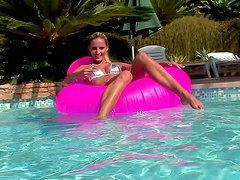 Neilla the slim blonde in bikini masturbates by the pool