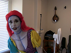 Sexy chick in a scary costume revealing her trimmed twat