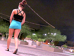 Pretty solo model in a sexy miniskirt pleasures herself while sitting in public