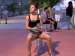Pretty solo model in a sexy miniskirt pleasures herself while sitting in public