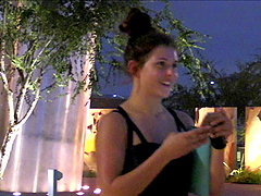 Pretty solo model in a sexy miniskirt pleasures herself while sitting in public