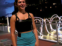 Pretty solo model in a sexy miniskirt pleasures herself while sitting in public