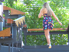 Teen lifts her dress and fucks a vegetable outdoors