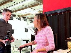 Model in a sexy tight dress blows the photographer