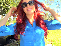 Sexy redheaded girl looks amazing in a miniskirt