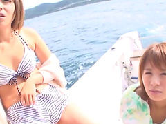 Adorable Japanese dolls suck fresh cum from a massive rod on a yacht