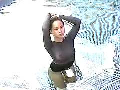 Asian model in sheer lingerie takes a dip in the pool