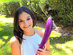 Cute girl gets naughty with her fruits and veggies outdoors