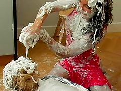 Cans of shaved cream emptied onto fully clothed ladies