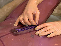 Babes bathing in skintight latex catsuits lick toes