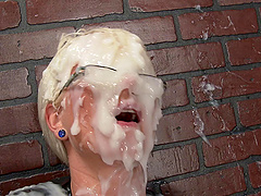 Rubber dick at a gloryhole squirts cream on this pretty girl