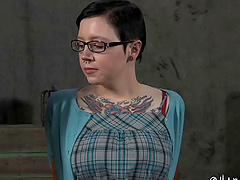 Tattooed big tits slave having her mouth inserted with toy in BDSM