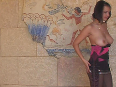 Maria Gudok wearing black uniform stretching in the living-room