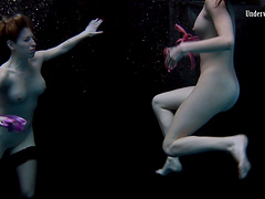 Sexy lesbian teen with her babe performing there teases underwater