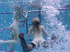 Sexy lesbian teen with her babe performing there teases underwater