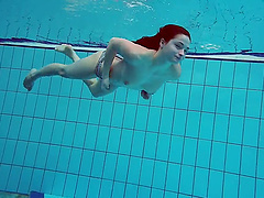 Redhead babe Liza Bubarek with natural tits stripping in the pool