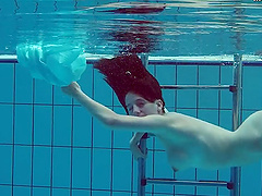 Piyavka Chehova jumps in the pool and gets naked underwater