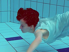 Piyavka Chehova jumps in the pool and gets naked underwater