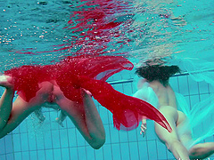 Redhead European lesbian teen getting cozy underwater