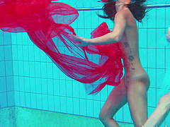Redhead European lesbian teen getting cozy underwater