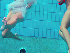 Redhead European lesbian teen getting cozy underwater