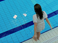 Tattooed small tits brunette babe showcasing her boobs at the pool