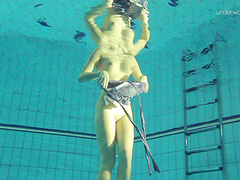 Redhead natural boobs solo model pose seductively underwater