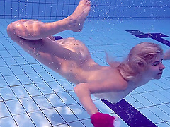Russian babe Elena Proklova with small tits swimming naked