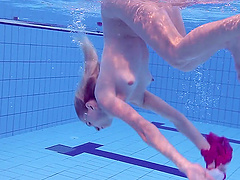 Russian babe Elena Proklova with small tits swimming naked