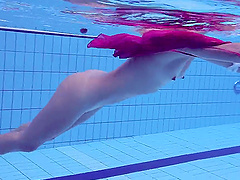 Russian babe Elena Proklova with small tits swimming naked