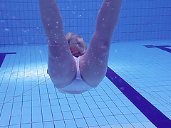 Russian babe Elena Proklova with small tits swimming naked
