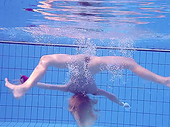 Russian babe Elena Proklova with small tits swimming naked